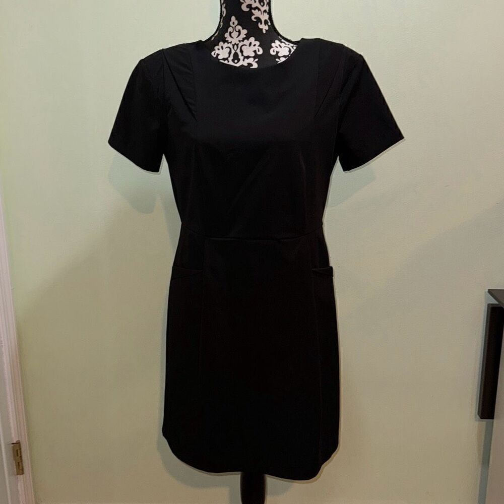 Olive and oak outfitters black pleated dress with shoulder pads size medium. Zoo